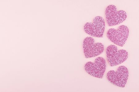background of big glitter pink heart decor rim on pink paper