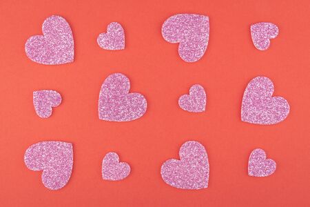 background of glitter red heart pieces pattern on red paper