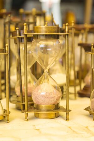 brass hourglass item in display shopfront in Dilli Haat, Delhi, India. Dilli Haat is traditional marketplace in delhiの写真素材