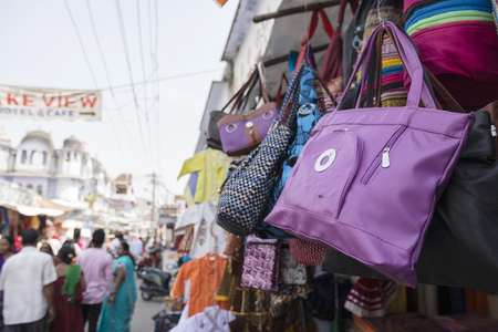 color pouch hanging display in shopfront at marketplace of Pushkar, Rajasthan, Indiaのeditorial素材