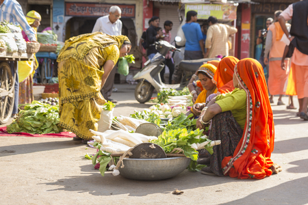 PUSHKAR INDIA-OCT 30 : candid shot of  india woman vegetable seller at marketplace in Pushkar on october,30, 2014, india.のeditorial素材