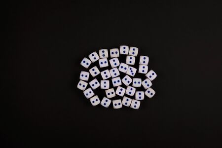 group of two side up of dice concept for business risk, chance, good luck or gambling, black paper backgroundの写真素材