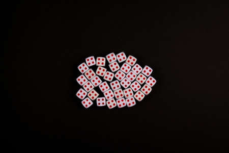 group of four side up of dice concept for business risk, chance, good luck or gambling, black paper backgroundの写真素材