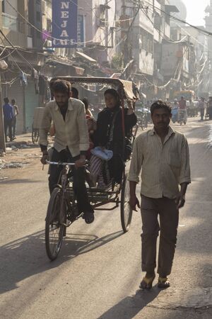 DELHI INDIA - APR 1 :   rickshaw taxi service in chawri bazar at old delhi. old delhi is famous place of delhi on april, 1, 2015, indiaのeditorial素材