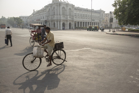 DELHI INDIA-JUN 18 : morning scene of traffic at Connaught place in central delhi of delhi on june, 18, 2015, india. this place is large shopping place in central delhiのeditorial素材