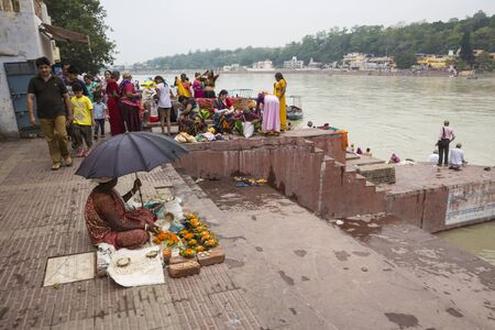 Rishikesh, India - June, 24, 2015 flower worship stall at Ganga river embankment in Rishikesh, Rishikesh is one of sacred city of hinduism.のeditorial素材