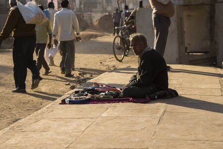 DELHI, INDIA - December 10 2014 : indian person with sale stall on street at chandni chowk in old delhi.のeditorial素材