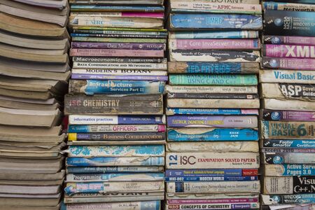 DELHI, INDIA - December 10 2014 : stack of old used textbook in marketplace at chawri bazar in old Delhi.のeditorial素材