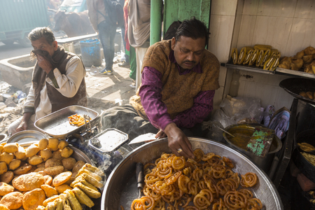 DELHI, INDIA - December 20 2014 : jalebi and sweet stall in spice market in Old delhi, this place is biggest herb and spice wholesale of delhi.のeditorial素材