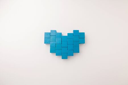 heart shape from array blue block toy on white paper background with copy spaceの写真素材
