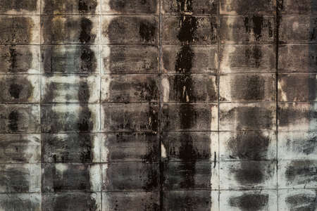 background of dirty grunge brick wall with black stainedの写真素材