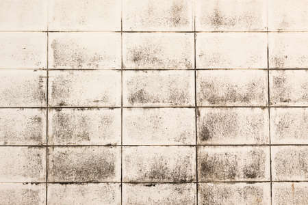 background of grunge brick white wall with old black stainedの写真素材