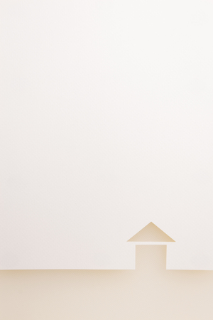paper cutout in basic house shape border with white background by white texture plate, for home and insurance conceptual.の写真素材