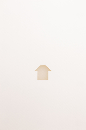 paper cutout in simple house shape by white textured plate on white paper background, for home and insurance conceptual.の写真素材
