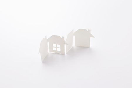 group linked of paper cutout houses with detail one on white background, for home and banking conceptual, selective focused.の写真素材
