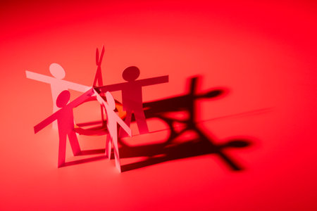 all in one joining of five paper figure on red light background. in concept of business, cooperation and critical.の写真素材