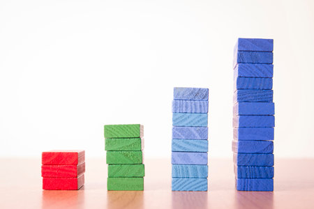 four step increase bar graph by multi color on white background in concept of profit, success and business.の写真素材