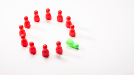 large circle arrangement of red plastic pin with fallen green position on white background, in concept of cooperation, difference and failure.の写真素材