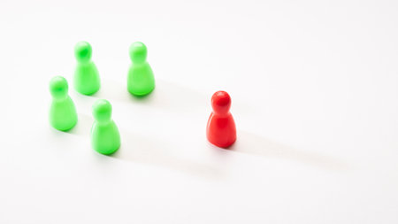 circle arrangement of five green plastic pin with out of position of red one on white background, in concept of cooperation, leadership and outstanding.の写真素材