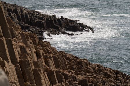 Seashore with green seawaterの写真素材