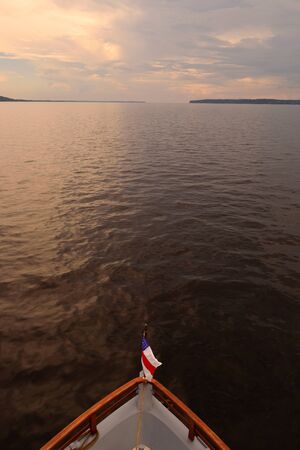 Rio Negro waters and the jungle at sunset, Amazon, Brazil.の写真素材