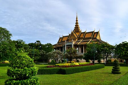 View of a building and adjacent gardens in the Royal Palace complex of Phnom Penh, Cambodiaの写真素材