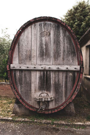 A close up of a huge wooden barrel for wine, Tuscany, Italy.の写真素材