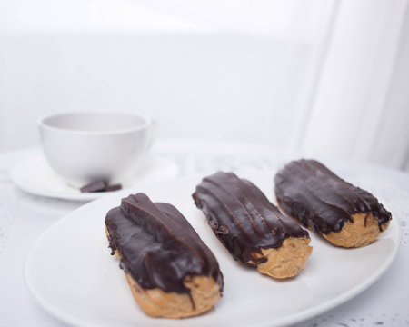Eclairs in chocolateの写真素材
