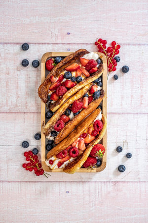 Dessert tacos with fresh berries and sauceの写真素材