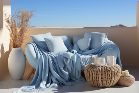 Light blue and beige interior with sofa, blanket and pillow, vases by the window and desert view in the background. Copy space. High quality photoの素材