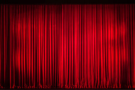 Red curtain closed on the stage of opening nightの写真素材