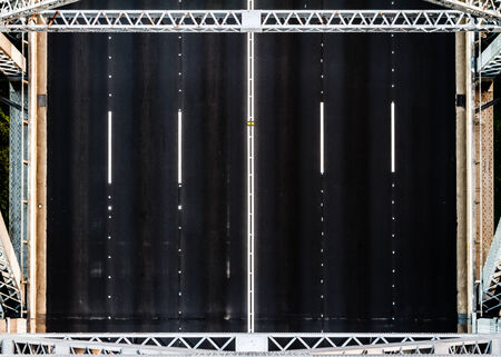 Overhead shot of a three lane road on a bridgeの写真素材
