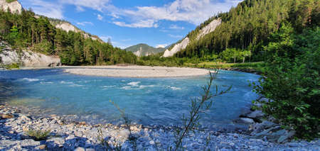 Rhine gorge Switzerland July 2020 forest, mountains and river against blue sky