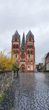 Front view of Limburg Cathedral on a rainy spring dayの写真素材