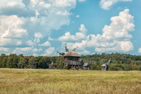 Old wooden windmill in the countryside are on the field 