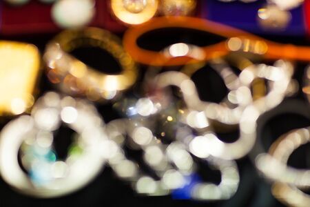 Round shiny blurred bokeh in the form of chains and bracelets texturesの写真素材