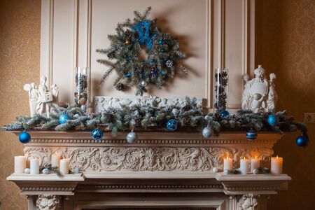 Christmas fireplace with decorations of fir branches and Christmas toysの写真素材