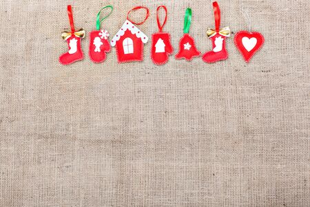 Set of Christmas toys handmade on burlapの写真素材