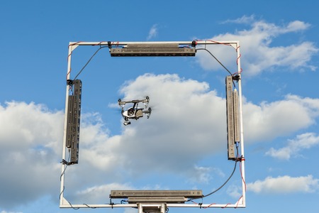 Copter flies through the frame. New unmanned aerial copter.の写真素材