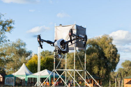 Black quadrocopter takes off up. Modern technology photo and video shooting.の写真素材