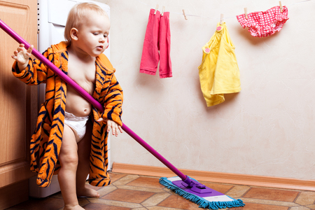 Child washes the floorの写真素材