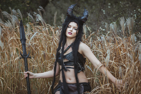 Portrait of a savage girl with hornsの写真素材