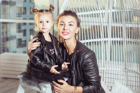 Mom and her little daughter. Mom hugs girl.の写真素材