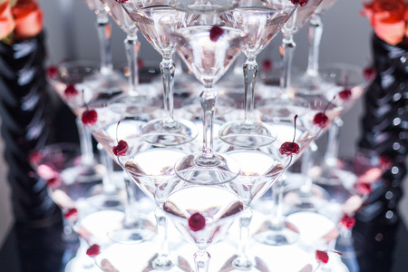Pyramid from glasses with martini on party.の写真素材