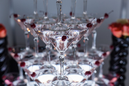 Pyramid from glasses with martini on party close up.の写真素材