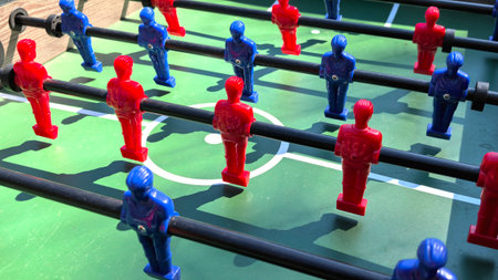 Table football game with red and blue players, closeup of photoの写真素材