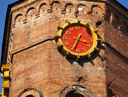 Old building tower with red clock in Ukraine Vinnitsa.