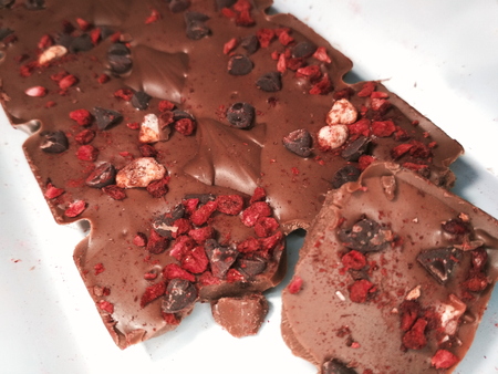 Macro photo sweet milk chocolate berry nut food tasty dessert.