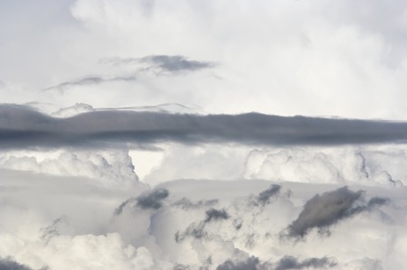 bizarre floating clouds after stormの写真素材