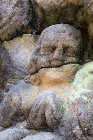 Rock relief - detail of the praying angelの写真素材